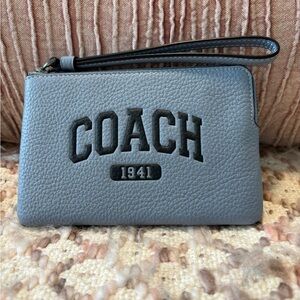 Coach Pebble Leather Wristlet in light blue with dark blue writing